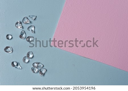 wedding background in pastel colors, sparkling decorative glowing stones on a blue background, framing, wedding card.