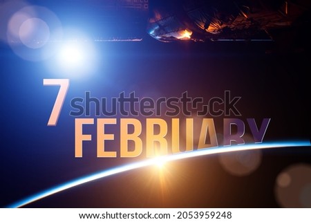 February 7th. Day 7 of month, Calendar date. The spaceship near earth globe planet with sunrise and calendar day. Elements of this image furnished by NASA. Winter month, day of the year concept