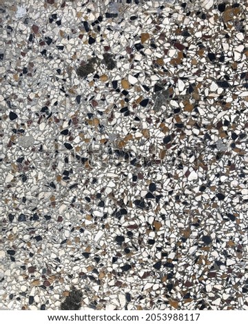 Small pebbles texture. Terrazzo. Floor in the city