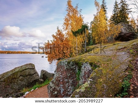Autumn landscape with picturesque rocks and yellowed trees