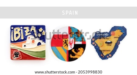 Magnetic souvenirs from Spain isolated on a white background. Names translated into English: Ibiza, Tenerife, De la Cruz, Santa Cruz, Teide volcano, Los Cristianos