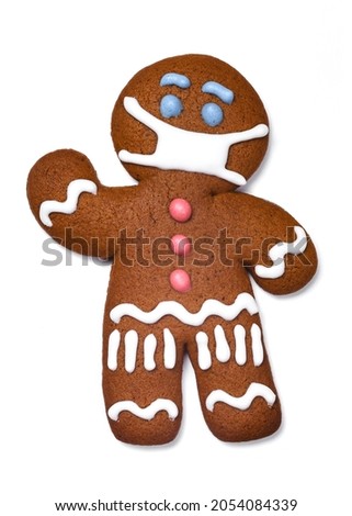 Classic gingerbread cookie man with medical mask isolated on white background