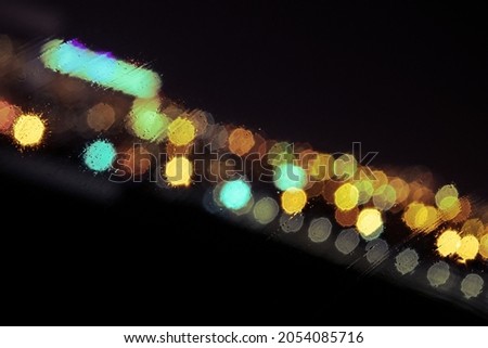 Light from cars and buildings with a defocused view.