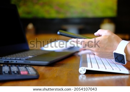 Businessman types on a computer keyboard. Banking and strategy planning. In the office, a financial analyst is working. Accounting for businesses and project management