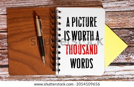 Business Term Phrase on Tablet PC with a cup of coffee and pens on a White Background - Black Word