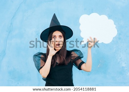 Funny Woman Wearing Witch Costume Holding Speech Bubble Making an Announcement. Halloween promoter girl announcing a sale in loud voice
