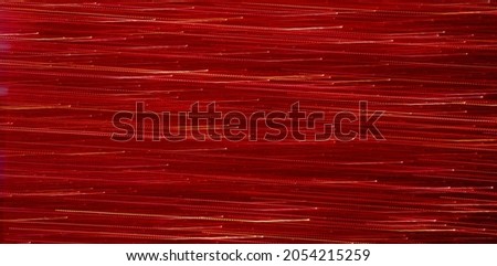 Blurred image of ,Dark red light streak moving horizontally.