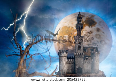 Fantastic landscape with a old castle on the background of a thunderstorm