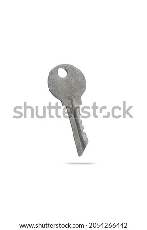  not new, old metal key from apartment house isolated on white background