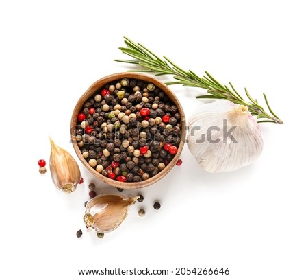 Bowl with mixed peppercorns, garlic and rosemary on white background Royalty-Free Stock Photo #2054266646