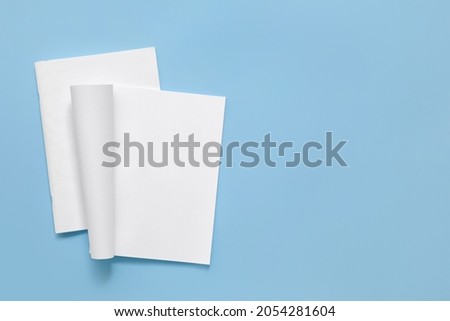 Blank magazines on color background