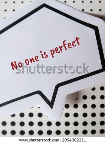 Sticker note paper written NO ONE IS PERFECT, concept of acceptance that perfection is not exist, stop being imperfectionist, impossible to be liked or impress everyone Royalty-Free Stock Photo #2054302211