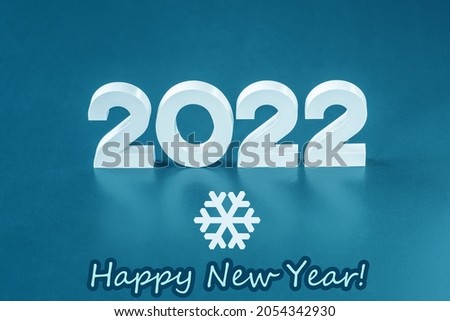 Volumetric white numbers 2021 on a cold background as a sketch for New Year's cards and congratulations.The text "Happy New Year!" Decorative snowflake.