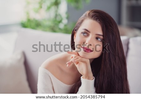 Photo of young attractive woman happy positive smile hand touch chin dream curious home comfort weekend