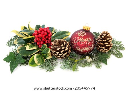 Merry christmas bauble with decoration of holly, mistletoe, ivy, fir and cedar leaf sprigs with gold pine cones over white background.