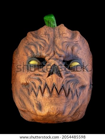 Pumpkin Head Mask Isolated Against Black Background