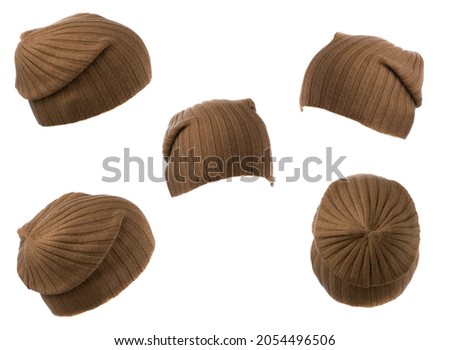 Set of five knitted brown hat isolated on white background .