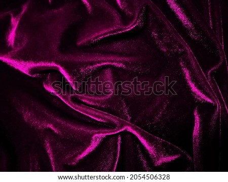 Magenta velvet fabric texture used as background. Empty magenta fabric background of soft and smooth textile material. There is space for text.