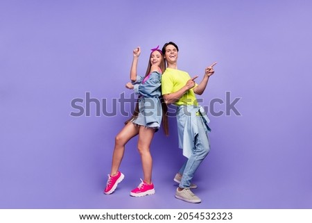 Photo of carefree funny couple dance disco retro event empty space wear pin-up outfit isolated violet color background