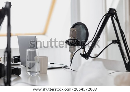 a recording studio with microphones and headphones. a studio for recording a podcast and creating audio content. a study on the radio for DJs and presenters and guests of the program on the radio