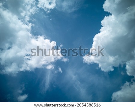 Beautiful blue sky with large white clouds. Postcard layout with place for text, wallpaper. Horizontal photo.