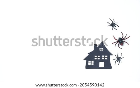 Halloween decor with spiders and scary house. Banner or party invitation white background with objects. Place for text. Design for Web ads, promotion, season sales, social media      