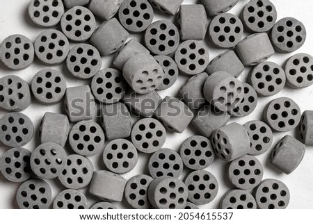 Renea nickel, also known as skeletal nickel is a solid microcrystalline porous nickel catalyst used in chemical processes for hydrogenation or hydrogen reduction of organic compounds. Top view Royalty-Free Stock Photo #2054615537