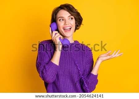 Photo portrait of woman talking on landline phone isolated on vivid yellow colored background Royalty-Free Stock Photo #2054624141