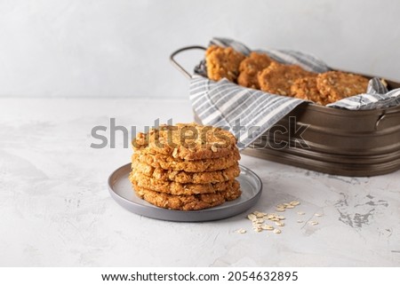 Homemade ANZAC biscuits. Traditional Australian oatmeal and coconut cookies. Space for text, close up  Royalty-Free Stock Photo #2054632895