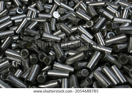 Manufacture of bearings in the factory.The chrome surface of products. Industrial theme. Shallow depth of field.