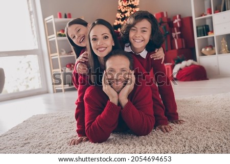 Photo of lovely family kid mommy daddy good mood enjoy x-mas holiday december magic spirit lying floor indoors