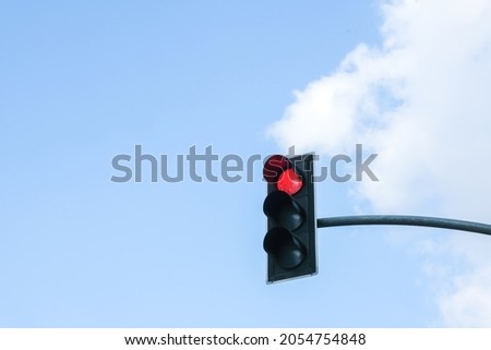 traffic light in front of cloudy sky background Royalty-Free Stock Photo #2054754848