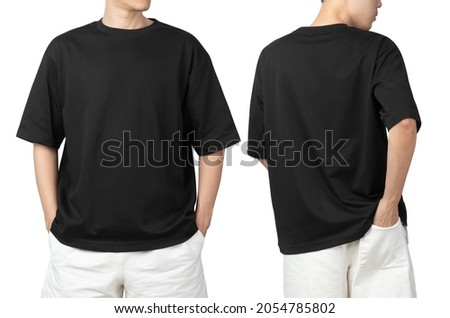 Young man in blank oversize t-shirt mockup front and back used as design template, isolated on white background with clipping path. Royalty-Free Stock Photo #2054785802