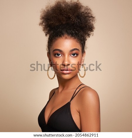 Beautiful smiling girl with curly hairstyle stock photo Women, African Ethnicity, Fashion Model, One Woman Only
