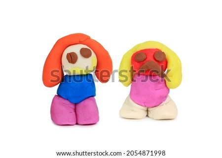 Plasticine colorful doll isolated on a white background.