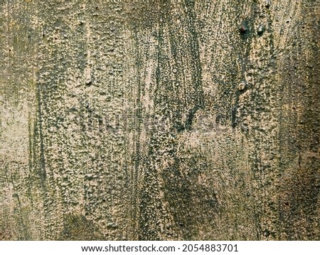 Green uneven cement wall, vintage background