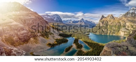 Panoramic View of Glacier Lake with Canadian Rocky Mountains in Background. Sunny Fall Day. Located in Lake O'Hara, Yoho National Park, British Columbia, Canada. Nature Panorama Royalty-Free Stock Photo #2054903402