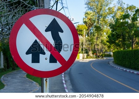 Traffic signs in the no-overtaking zone which can cause accidents are located along the road leading to the village