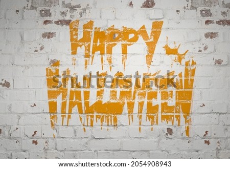 Happy Halloween graffiti wall, with orange paint