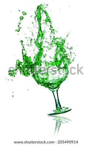 green  splash out drink from glass on white background.