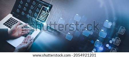 Businessman working modern compter Document Management System (DMS),Virtual online documentation database and process automation to efficiently manage files,documentation in enterprise with ERP. Royalty-Free Stock Photo #2054921201