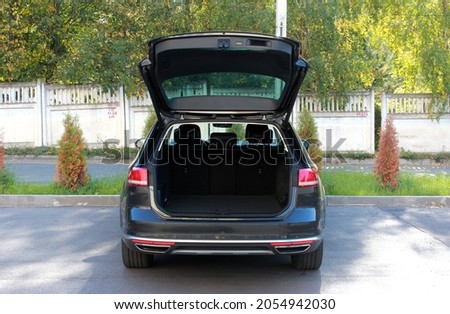 Modern car with open empty trunk. Modern wagon car open trunk. Car boot is open. Royalty-Free Stock Photo #2054942030
