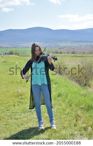 beautiful portrait of a girl and a violin,