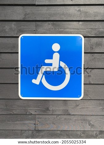 blue traffic sign wheelchair user