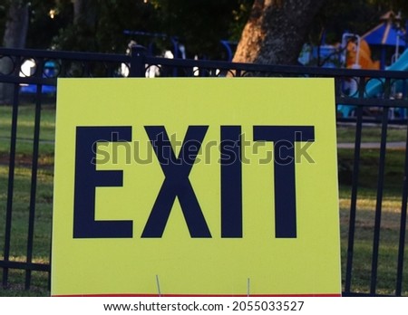YELLOW AND BLACK EXIT SIGN
