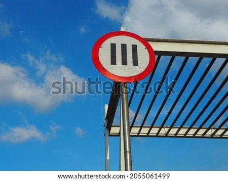 Road sign with clear bright blu sky on sunny day.