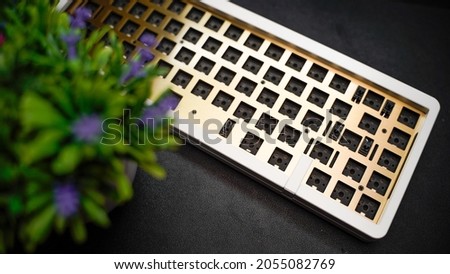 A premium 65% layout custom Aluminium mechanical keyboard with brass plate
