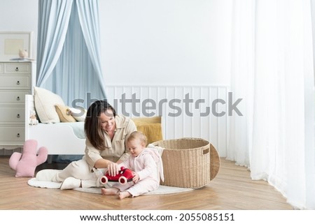 Mother and toddler playing together Royalty-Free Stock Photo #2055085151
