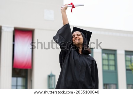 Girl graduating high school, celebrating academic achievement Royalty-Free Stock Photo #2055100040