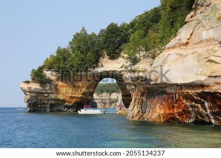 Tourists at Lovers Leap Arch, Pictured Rocks National Lakeshore of Lake Superior, Munising, Michigan, USA
